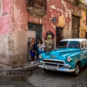 blue classic car parked on the street in Havana