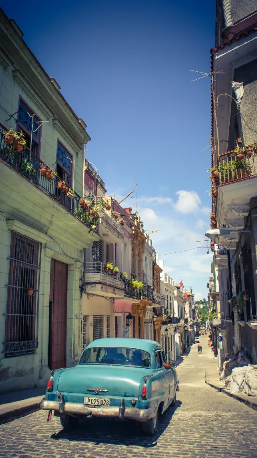 blue classic car in streets of havana